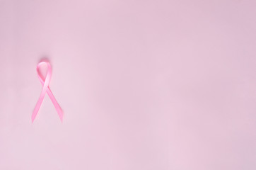 Top view of pink ribbon, symbol of breast cancer.Empty space for text
