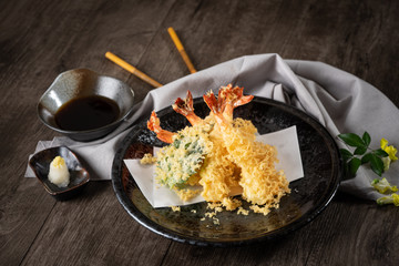 The tempura shrimps with sauce, deep-fried shrimps in the traditional Japanese restaurant.