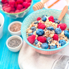 breakfast buckwheat porridge with raspberries and blueberries, good morning concept