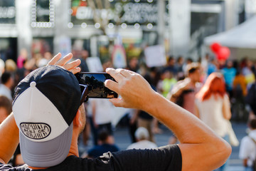 Recording a parade with cell phone at Belgrade pride parade