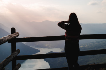 Silhouette of a woman standing on the top of the mountain Tara