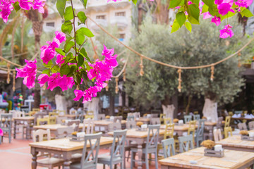 Street restaurant with eco wooden tables. Natural style