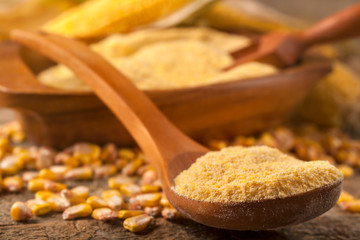 Homemade organically produced corn gritz polenta on a rustic wooden table