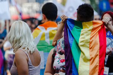 Young people with rainbow flag at Belgrade pride parade