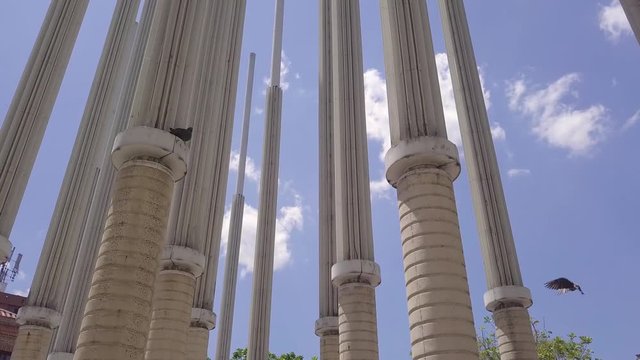 Incredible 4k sliding shot of sculptures and blue sky in Parque De Las Luces