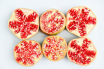 round sliced slices of red natural pomegranate with grains