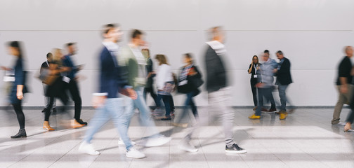 Crowd of people walking at trade fair