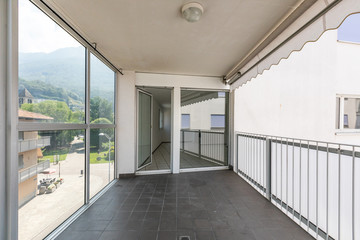 Covered terrace with large windows and views