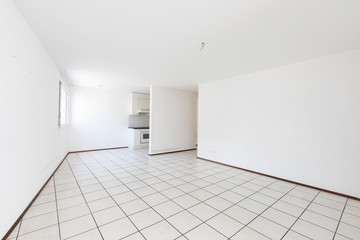 Empty room with vintage kitchen, white tiles and walls