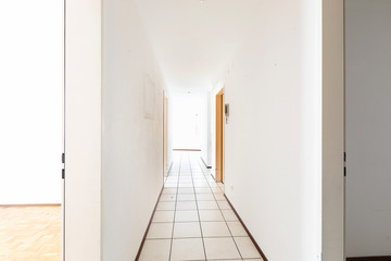 White empty corridor with tile
