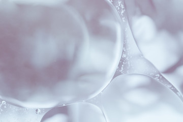 Close up transparent bubbles on gray shades