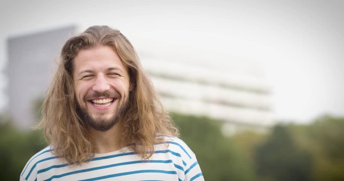 Portrait of a happy man with long hair