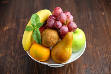 Whole fruits on a white plate. Restaurant menu