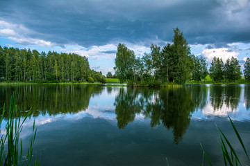 Obraz premium Summer day mirrored water lake outdoors
