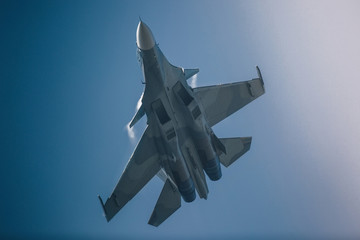 Fototapeta na wymiar Modern jet fighter at the sky