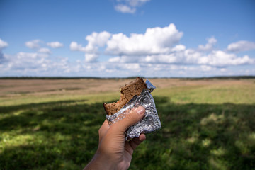 Vegetable sandwich outside summer day clouds