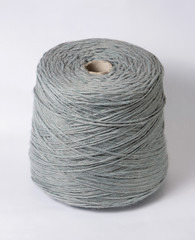bobbin of yarn on a white background. Side view.Textile reel on isolated white background.