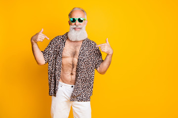 Photo of cheerful nice old man pointing at himself to show you his handsomeness while isolated with...