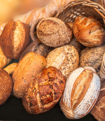 Mixed Fresh Bread as background, top view.  Rustic loaves of bread close up.   Food concept.