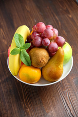 Whole fruits on a white plate. Restaurant menu