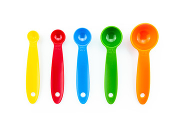 a set of measuring spoon of plastic on white background.