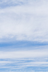 White fluffy clouds in the blue sky in summer