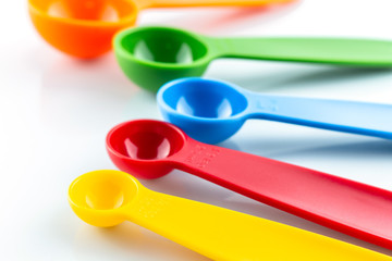 a set of measuring spoon of plastic on white background.