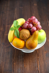 Whole fruits on a white plate. Restaurant menu