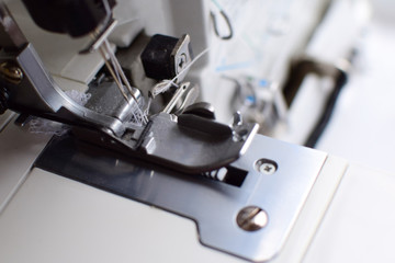 Overlock sewing machine close-up.