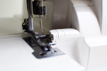Overlock sewing machine close-up.