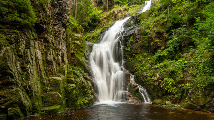 Waterfall in mountains. Famous Kamienczyk waterfall in the Karkonosze National Park in Sudety mountains, Poland