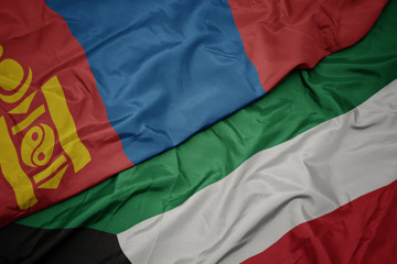 waving colorful flag of kuwait and national flag of mongolia.
