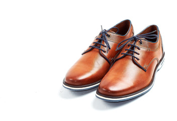 luxurious male brown and blue leather shoes isolated on a white