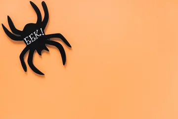 Fotobehang Black spider with Eek! inscription in corner © Freepik