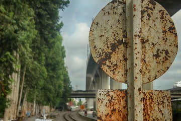 Railroad and Metal rust on guide post background