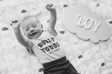 Naklejka premium a child who screams with delight. The little boy raised his hands. the concept of freedom of expression of feelings, emotions, IVF, happiness