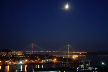 Fototapeta na wymiar Night landscape with views of the Russian bridge.