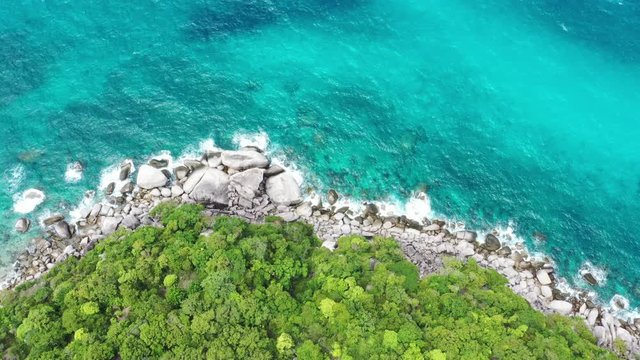 Aerial top view form flying drone of beautiful turquoise blue ocean tropical seascape island for summer vaction on paradise beach.