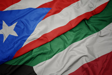 waving colorful flag of kuwait and national flag of puerto rico.