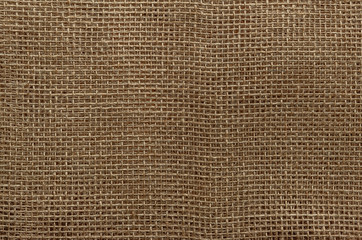 Fototapeta na wymiar abstract background of burlap fabric close up