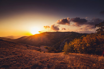 Golden sunset in autumn mountains