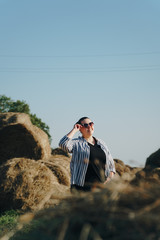 portrait of a beautiful girl on a background of haystacks 1