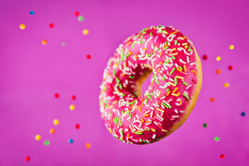 Flying multicolored Donuts with sprinkles
