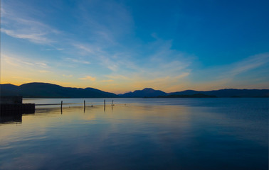 Loch Lomond sunset, the calm water of the famous scottish loch on a calm summer evening