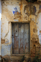 Old and deteriorated door with very vintage colors