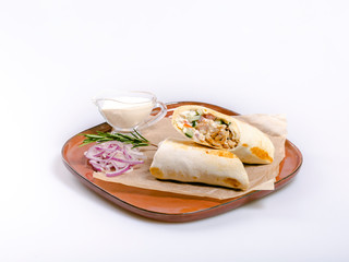 Traditional shawarma roll on a plate isolated