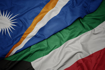 waving colorful flag of kuwait and national flag of Marshall Islands .