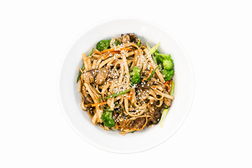 Wok noodles with toppings top view isolated on white background