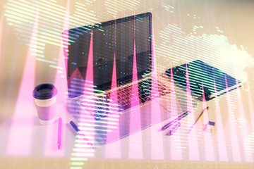 Stock market chart with globe hologram and desktop office computer background. Multi exposure. Concept of financial analysis.