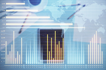 Double exposure of forex chart and world map on digital tablet laying on table background. Concept of market analysis